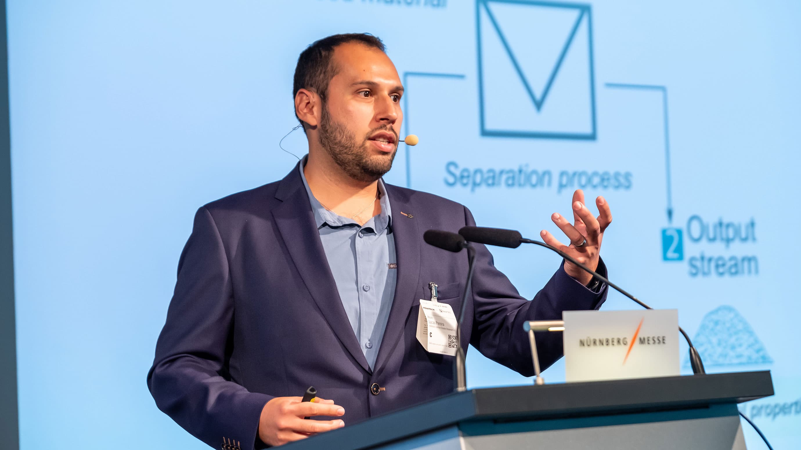 Expert giving a speech at a speakers desk